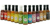 Row of Fat Cat hot sauce bottles with colorful labels on a white background